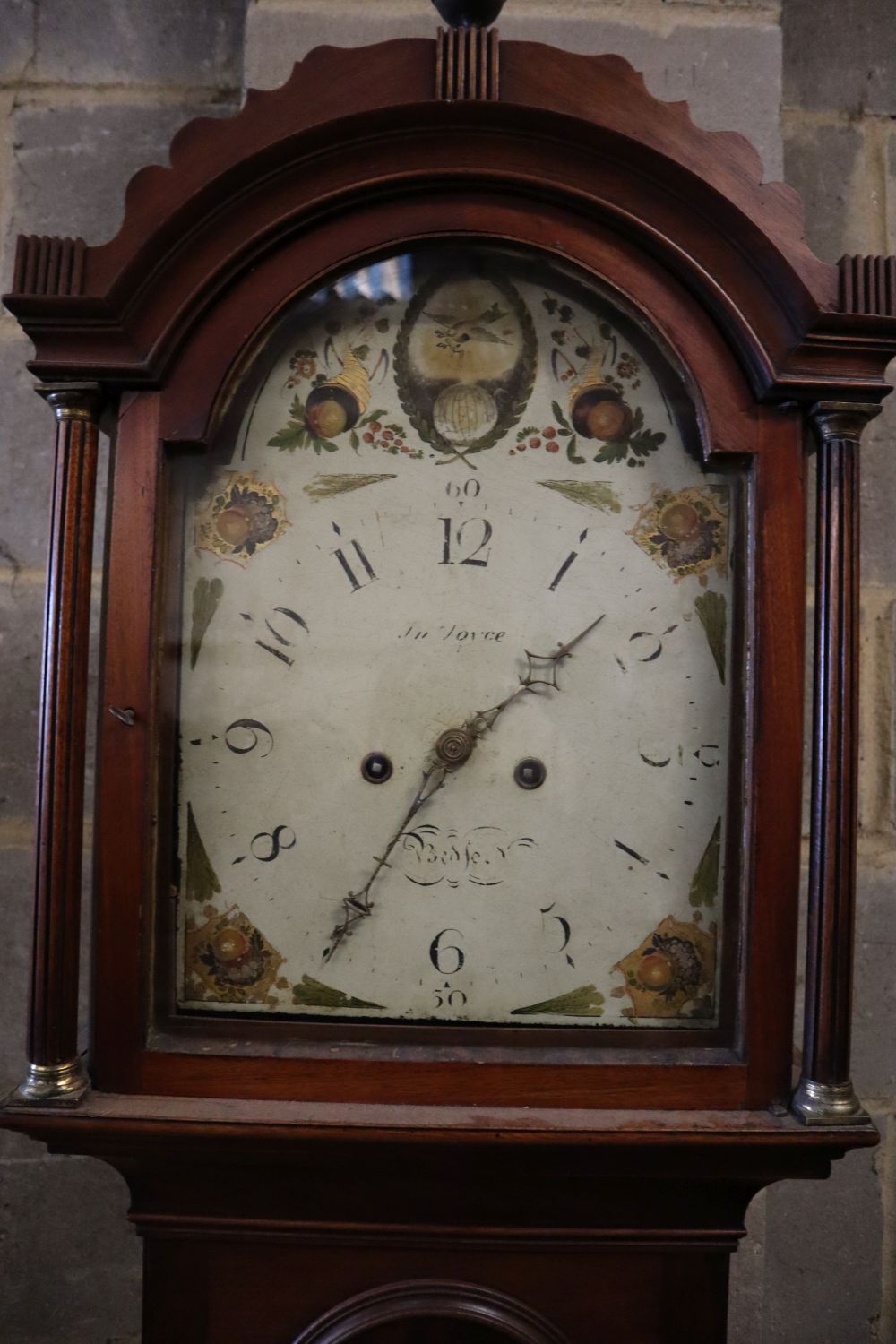 A George III mahogany eight day longcase clock, the painted arched dial signed J.N. Joyce of Bedford, width 45cm height 217cm